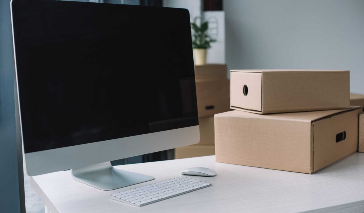desktop computer with blank screen and cardboard b w9ynnhx.jpg