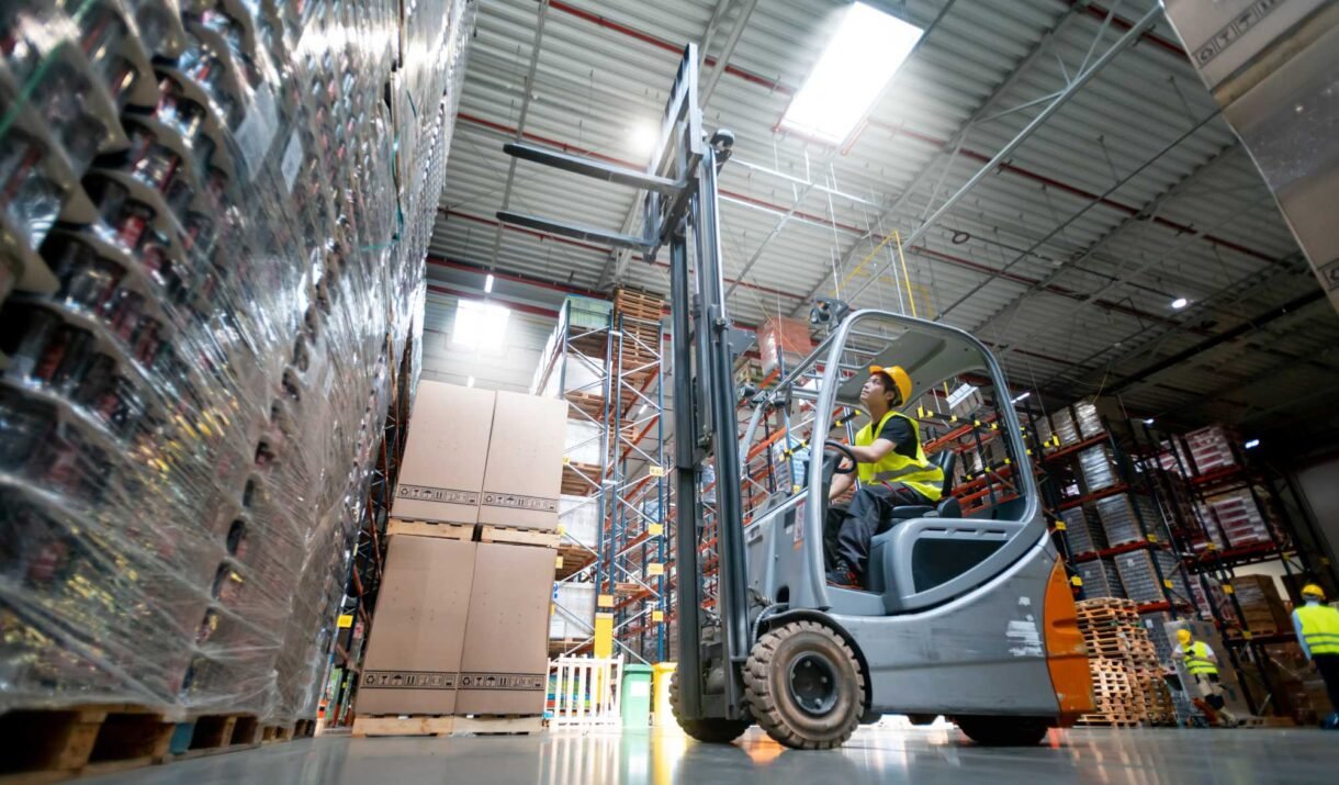 warehouse worker operates a forklift nrcb2se.jpg