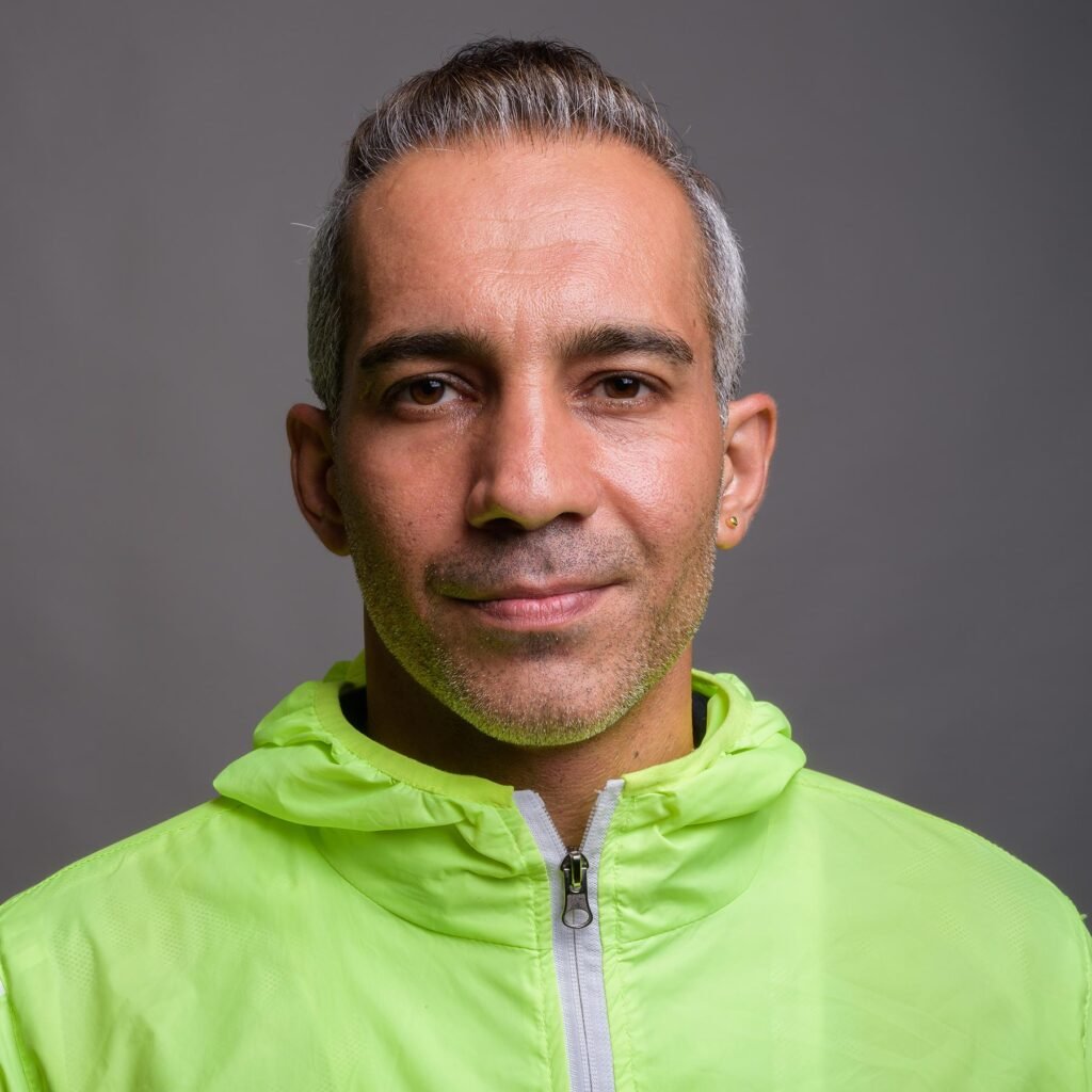handsome persian man with gray hair wearing jacket yy43jxy 1.jpg